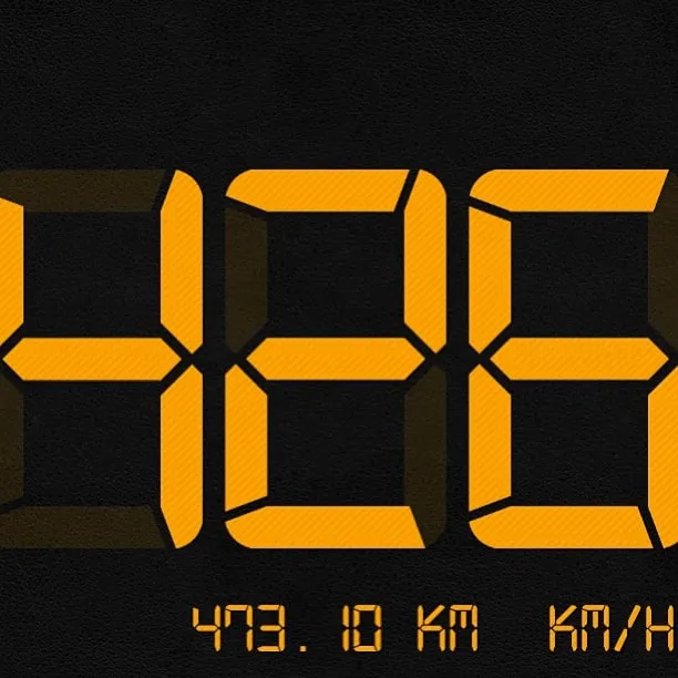 Yellow digital display on a black background showing a speed of 426 km/h.