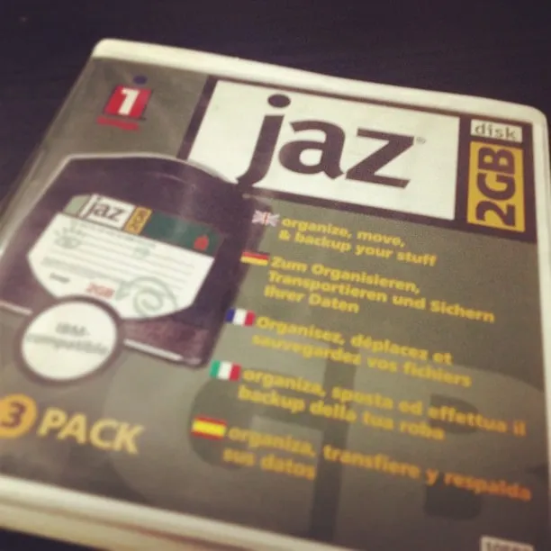 A pack of 2GB Iomega Jaz disks on a dark surface